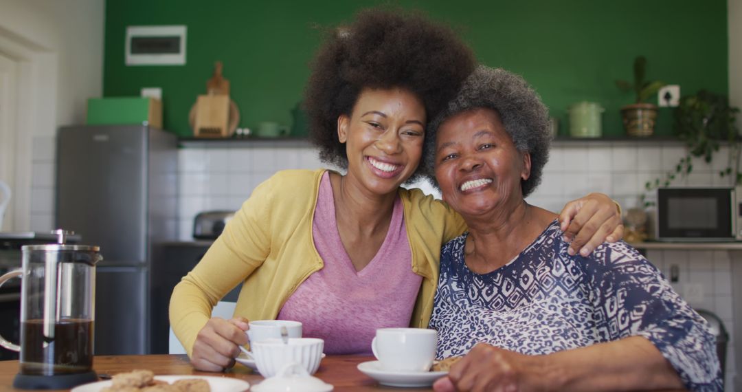 Loving African American grandmother and granddaughter enjoying coffee together - Free Images, Stock Photos and Pictures on Pikwizard.com