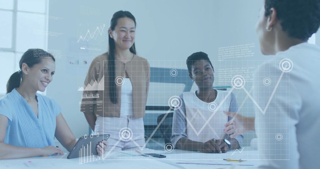 Businesswomen Collaborating with Digital Analytics Interface