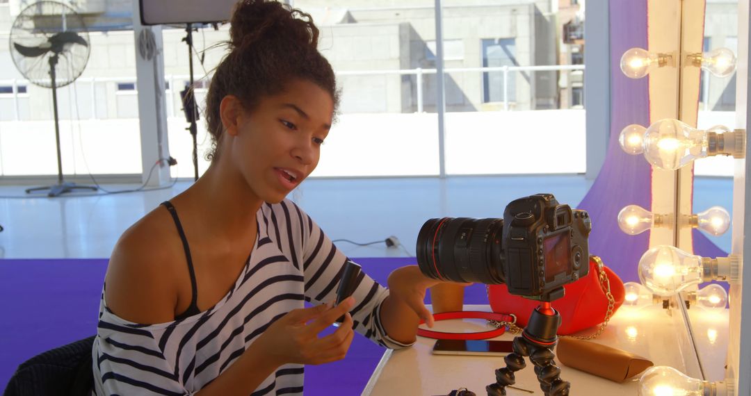 Young Influencer Vlogging While Sitting at Dressing Table with Camera - Free Images, Stock Photos and Pictures on Pikwizard.com