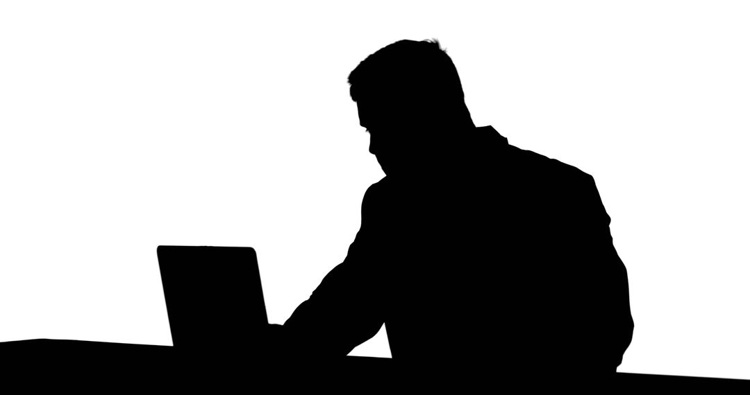 Silhouette of Businessman Typing on Laptop at Desk - Free Images, Stock Photos and Pictures on Pikwizard.com