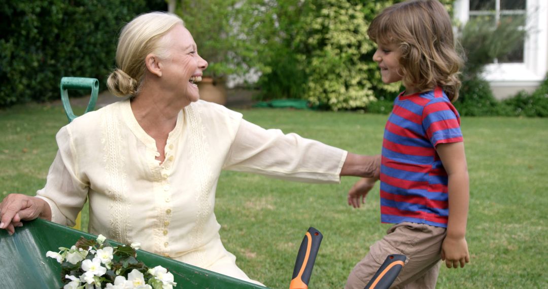 Smiling Grandmother and Child Gardening Together in Backyard - Free Images, Stock Photos and Pictures on Pikwizard.com