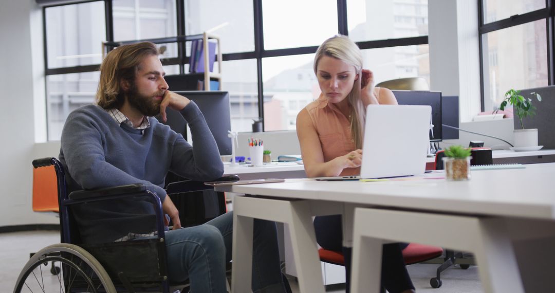 Inclusive Workplace Collaboration Between Wheelchair User and Colleague