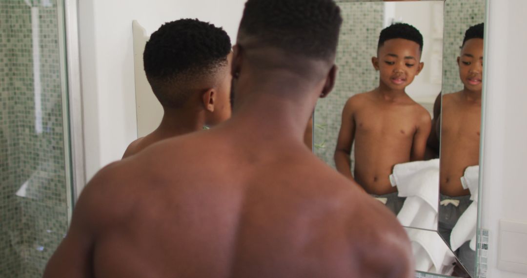 Father and Son in Bathroom Mirror Reflection - Free Images, Stock Photos and Pictures on Pikwizard.com