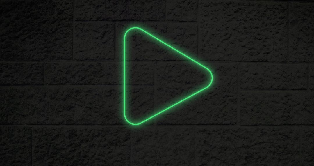 Glowing Green Neon Play Button on Textured Wall