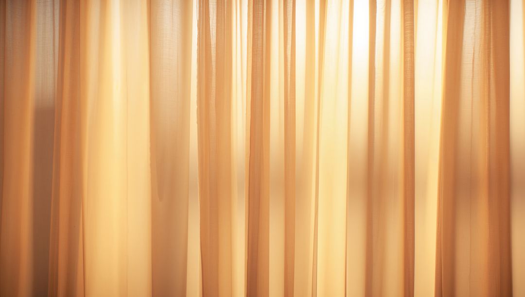 Backlit sheer curtains filtering golden sunlight through pleated beige drapery