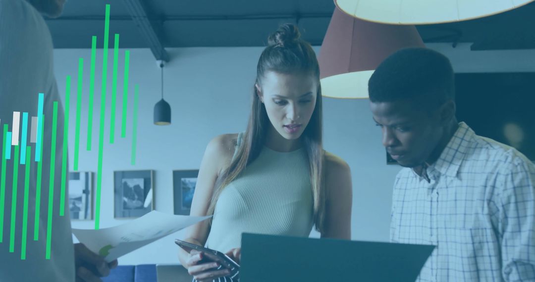 Co-Workers Analyzing Charts in Modern Office Setting