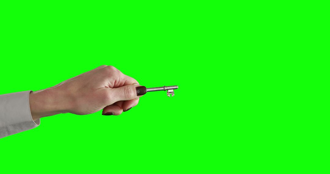 Woman Holding Silver Key on Green Screen Background - Free Images, Stock Photos and Pictures on Pikwizard.com