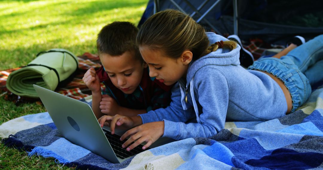 Kids Learning Outdoors Together with Laptop - Free Images, Stock Photos and Pictures on Pikwizard.com