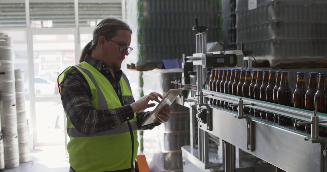 Quality Control Manager Inspecting Beverage Bottles in Factory - Free Images, Stock Photos and Pictures on Pikwizard.com