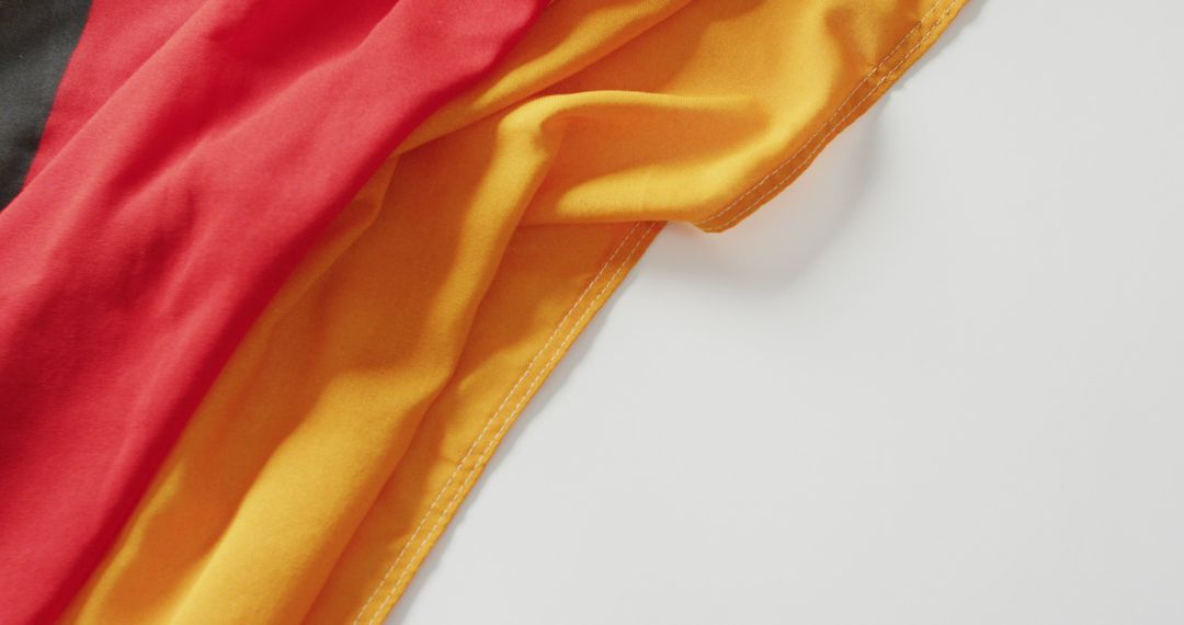 Image of creased flag of germany lying on white background - Free Images, Stock Photos and Pictures on Pikwizard.com