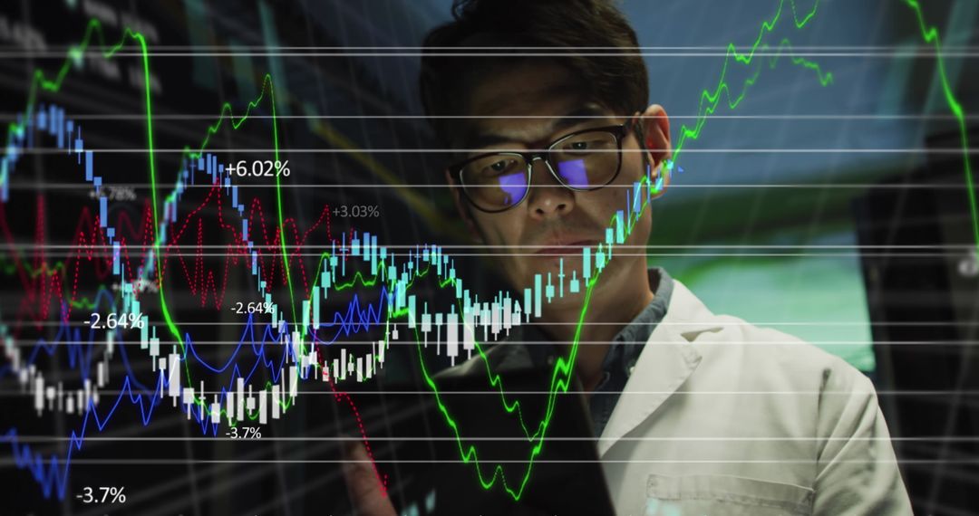IT Engineer Analyzing Stock Market Data on Tablet with Digital Graphics