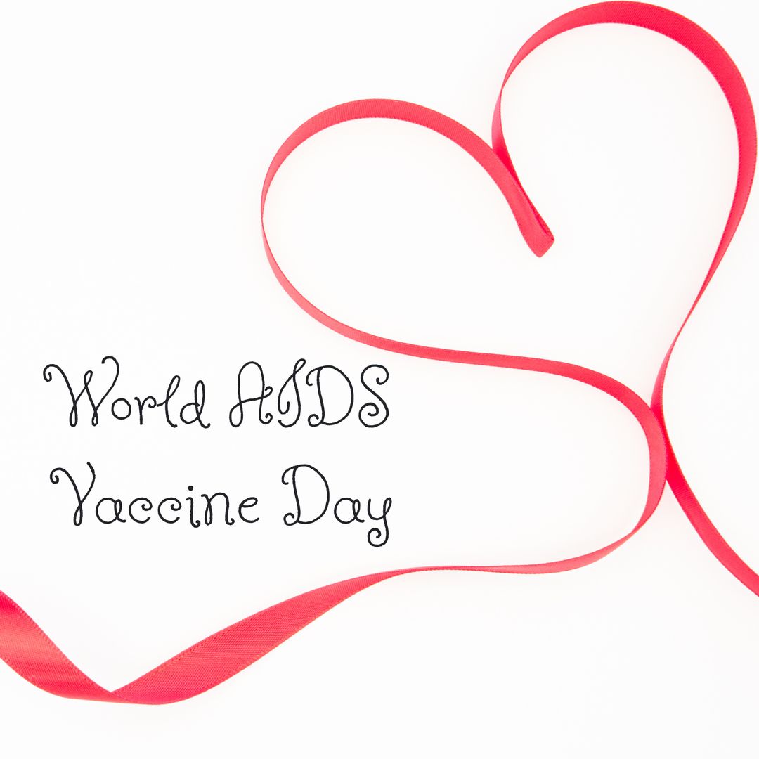 World AIDS Vaccine Day Concept with Heart Shaped Red Ribbon