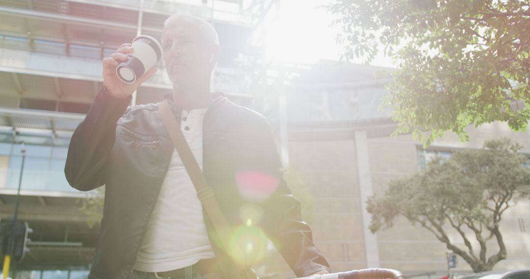 Mature Man Drinking Coffee Outdoors on Sunny Day - Free Images, Stock Photos and Pictures on Pikwizard.com