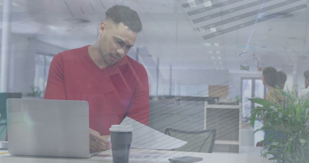 Focused Businessman Analyzing Financial Reports in Modern Office