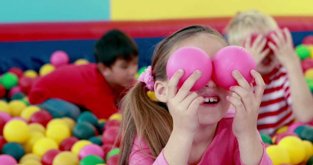 Children Playing Joyfully in Colorful Ball Pit at Play School
