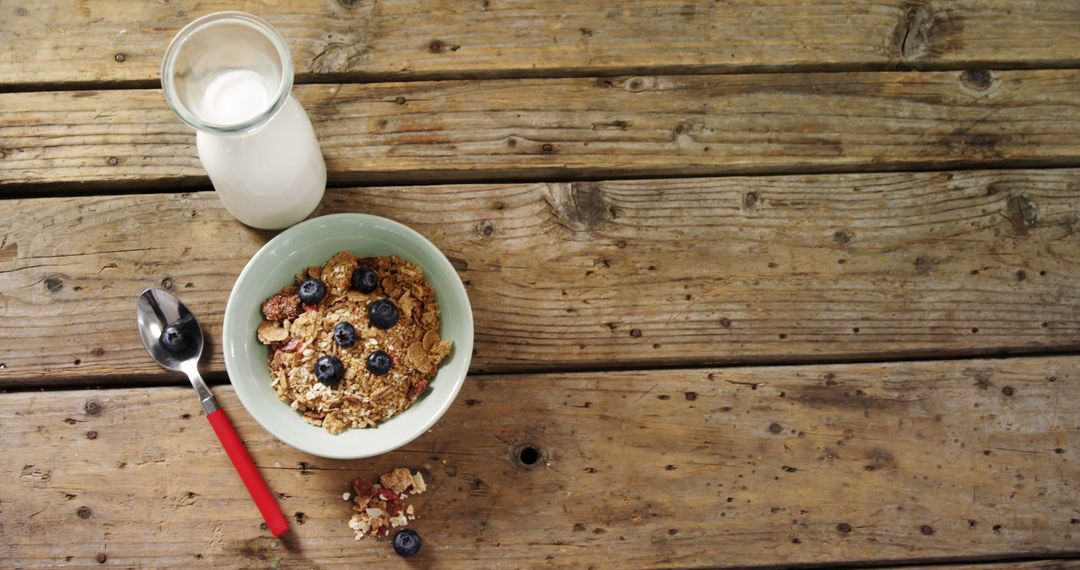 Healthy Breakfast with Granola and Fresh Blueberries on Rustic Wooden Table - Free Images, Stock Photos and Pictures on Pikwizard.com