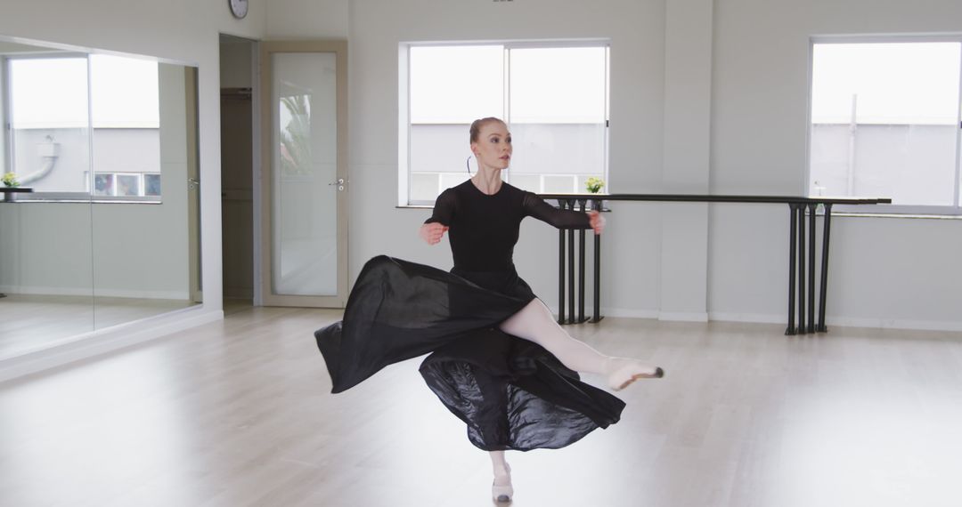 Ballet Dancer Performing in Empty Studio - Free Images, Stock Photos and Pictures on Pikwizard.com