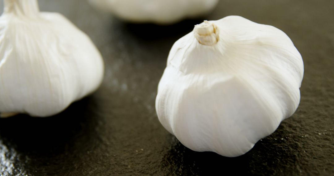 Whole Fresh Garlic Bulbs on Dark Background - Free Images, Stock Photos and Pictures on Pikwizard.com