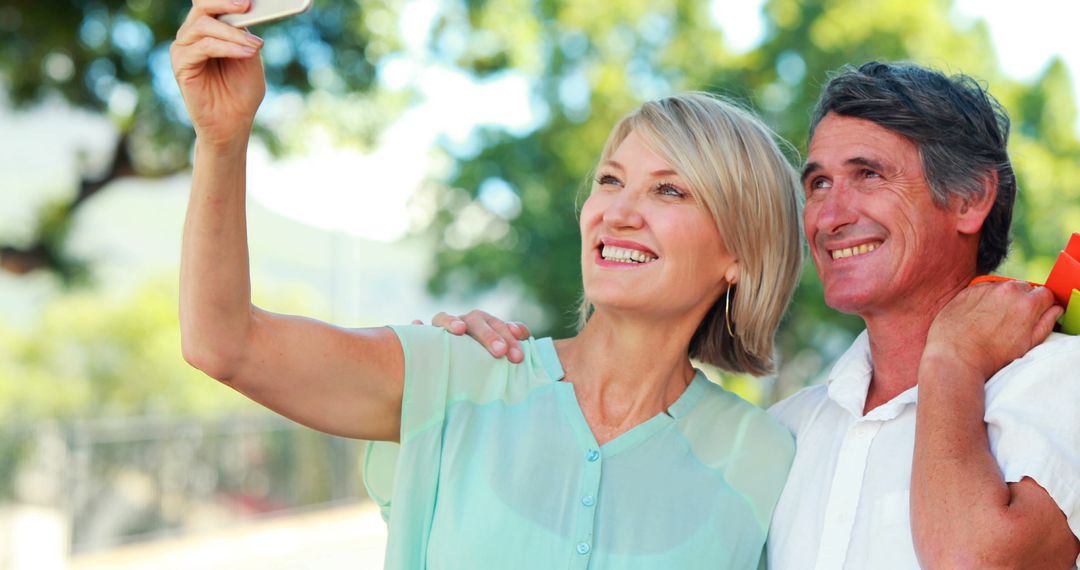 Happy Elderly Couple Taking a Selfie Outdoors - Free Images, Stock Photos and Pictures on Pikwizard.com