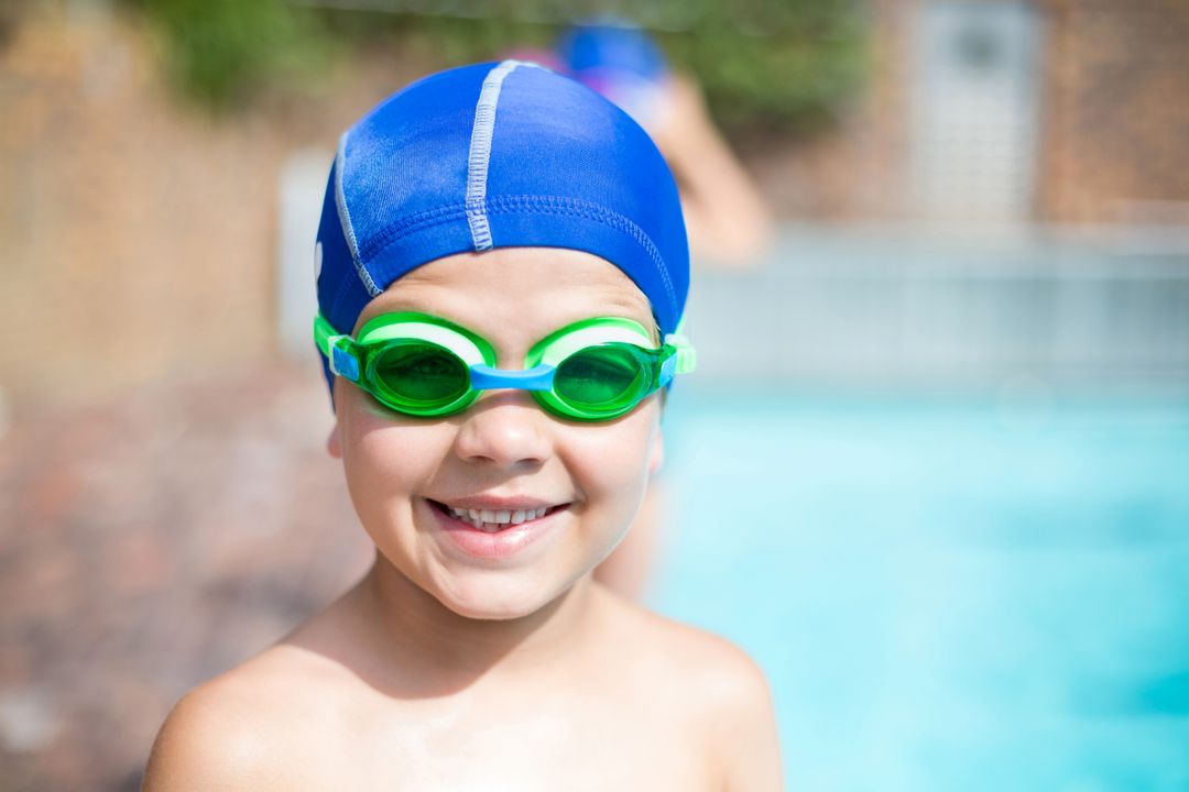 Little boy wearing swimming goggle and cap  - Free Images, Stock Photos and Pictures on Pikwizard.com