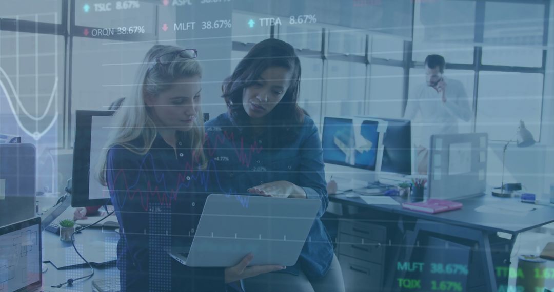 Colleagues Analyzing Data in Open-Plan Office