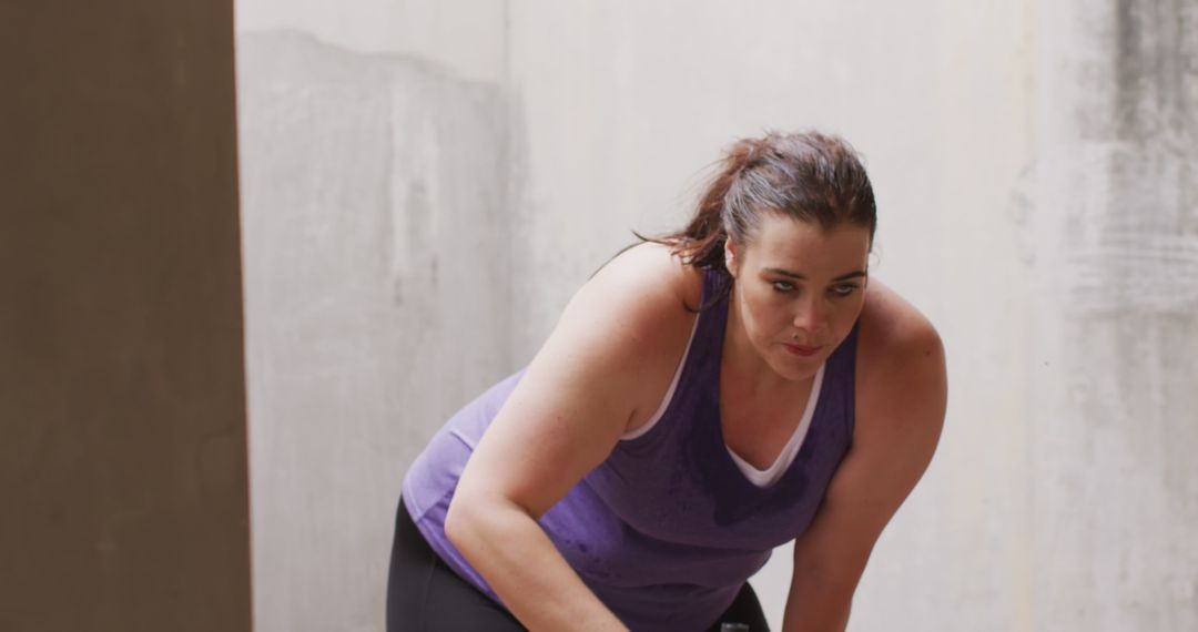 Determined Plus-Size Woman Taking Intense Workout Break - Free Images, Stock Photos and Pictures on Pikwizard.com