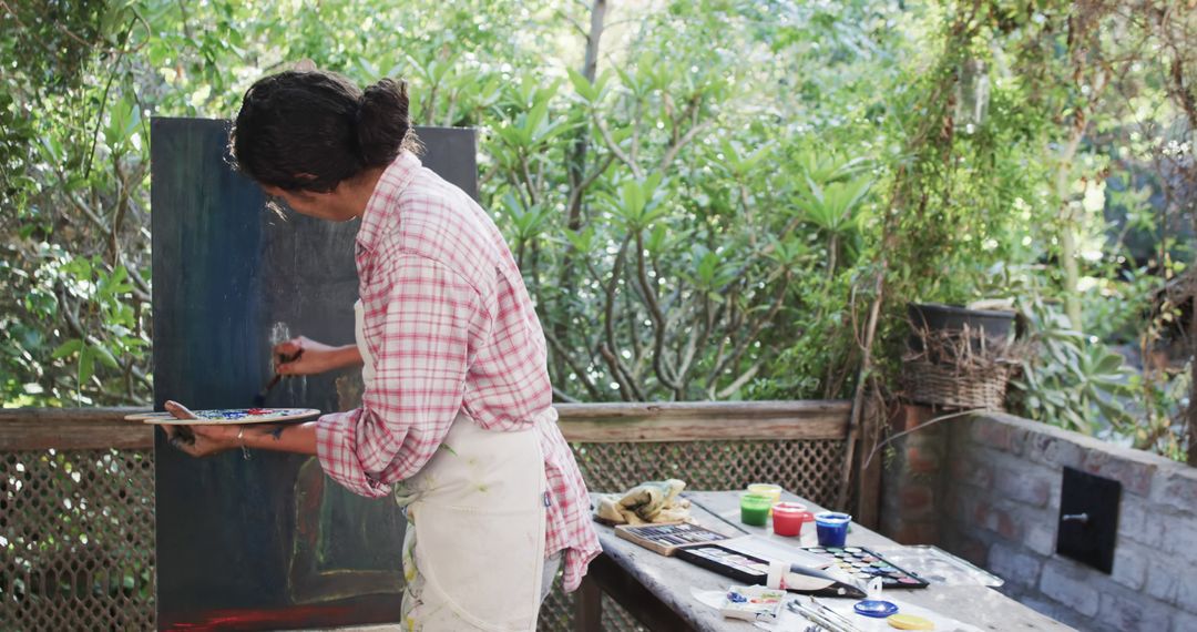 Woman Painting Outdoors in Home Garden - Free Images, Stock Photos and Pictures on Pikwizard.com