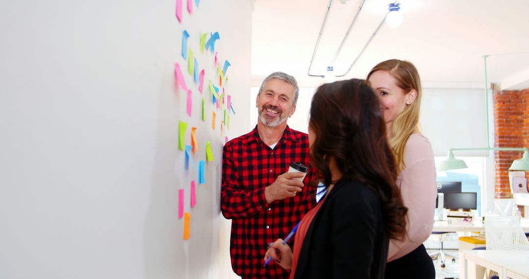 Diverse Team Collaborating in Bright Office with Sticky Notes
