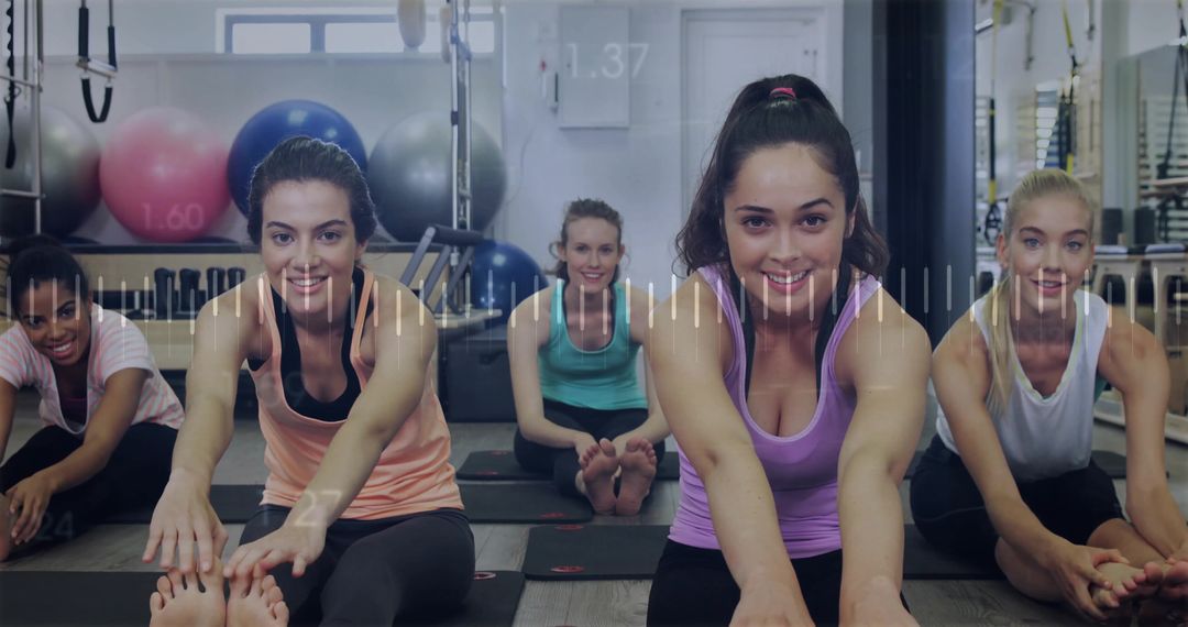 Diverse Group of Women Stretching in Gym Meditation Studio