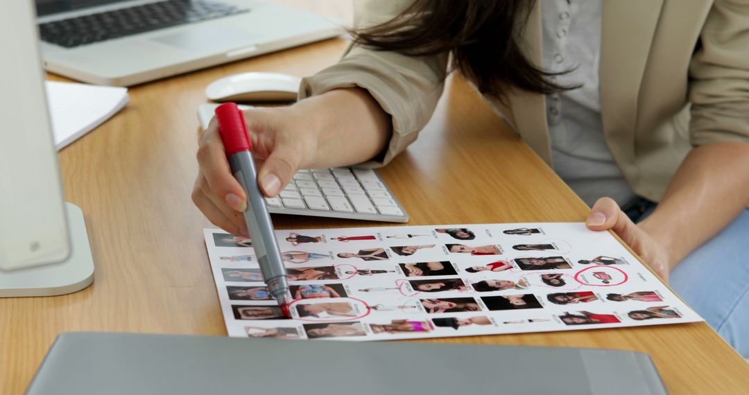 Woman Reviewing Model Portfolio at Desk - Free Images, Stock Photos and Pictures on Pikwizard.com