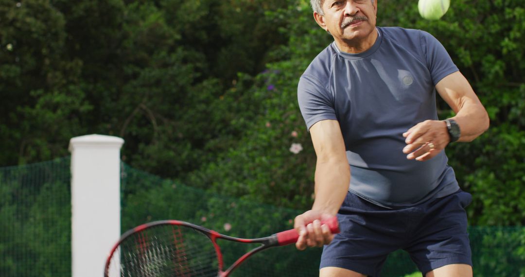 Senior Man Playing Tennis Outdoors in Action Shot - Free Images, Stock Photos and Pictures on Pikwizard.com