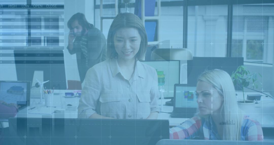 Diverse Team Analyzing Data in Modern Office with Digital Interface