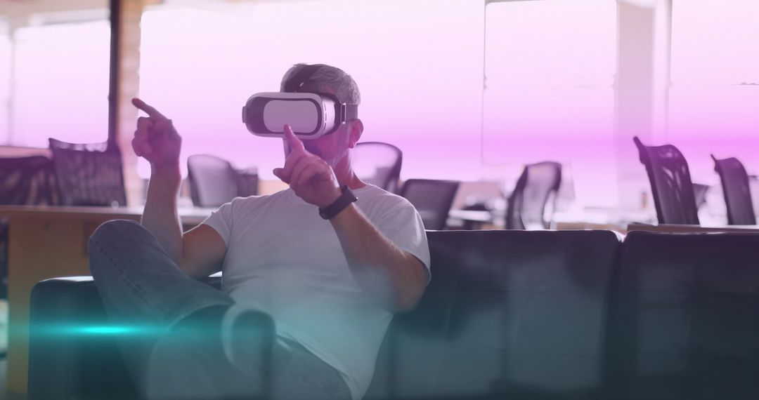 Man Exploring Virtual Reality With Advanced VR Headset in Modern Office