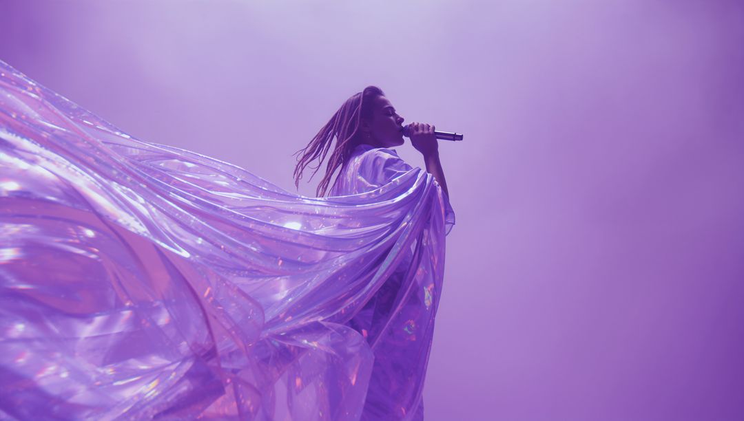 Glamorous Female Singer Performing on Stage with Flowing Iridescent Cape