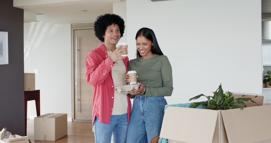 Smiling Couple with Coffee during Moving Day