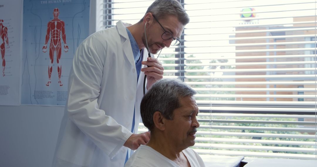 Doctor Using Stethoscope Examining Senior Patient in Clinic - Free Images, Stock Photos and Pictures on Pikwizard.com