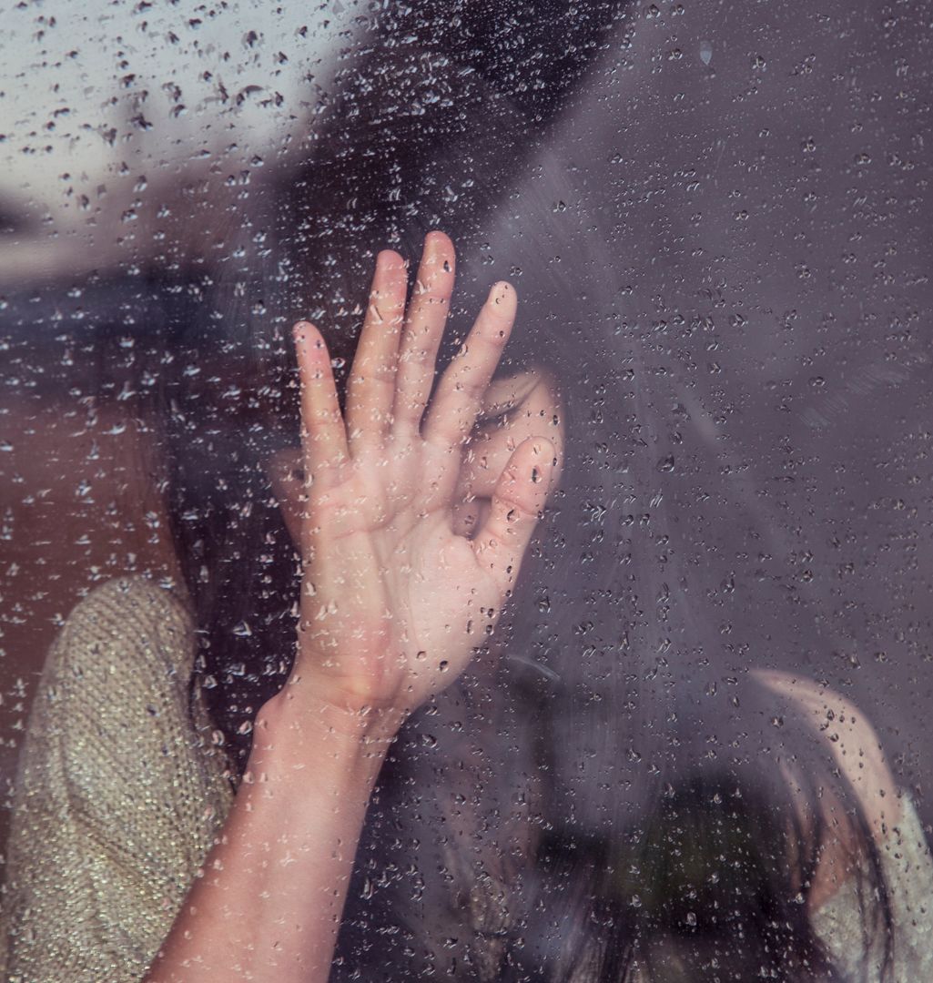 Woman's Hand Pressing Against Rainy Window On Overcast Day - Free Images, Stock Photos and Pictures on Pikwizard.com