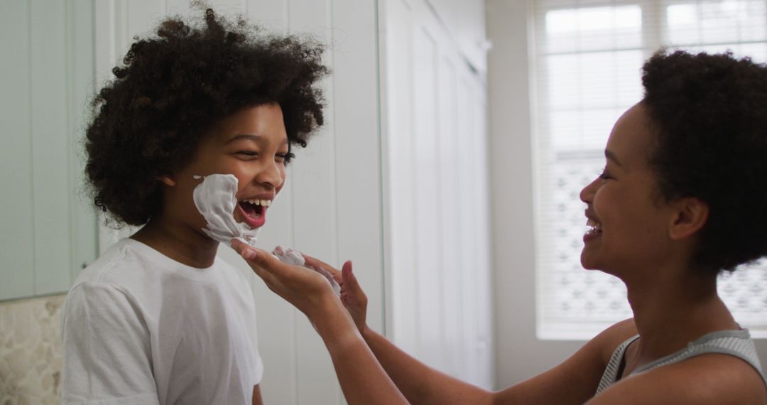 Mother and Son Laughing During Shaving Foam Play in Bathroom - Free Images, Stock Photos and Pictures on Pikwizard.com