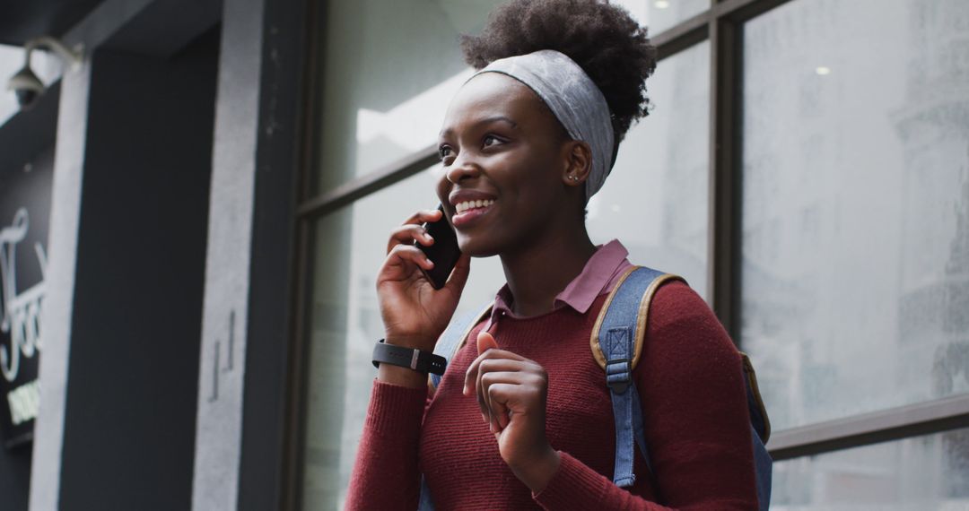 Smiling African American Using Smartphone Outdoor During Pandemic