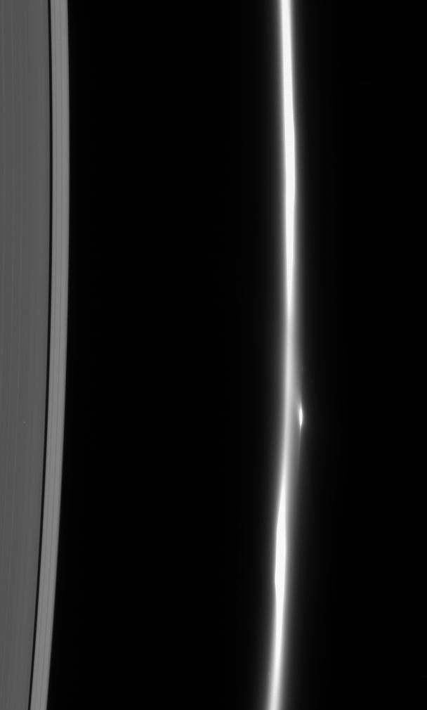 Close-up of Saturn's F Ring Showing Dissolving Particles and Bright Clump - Free Images, Stock Photos and Pictures on Pikwizard.com
