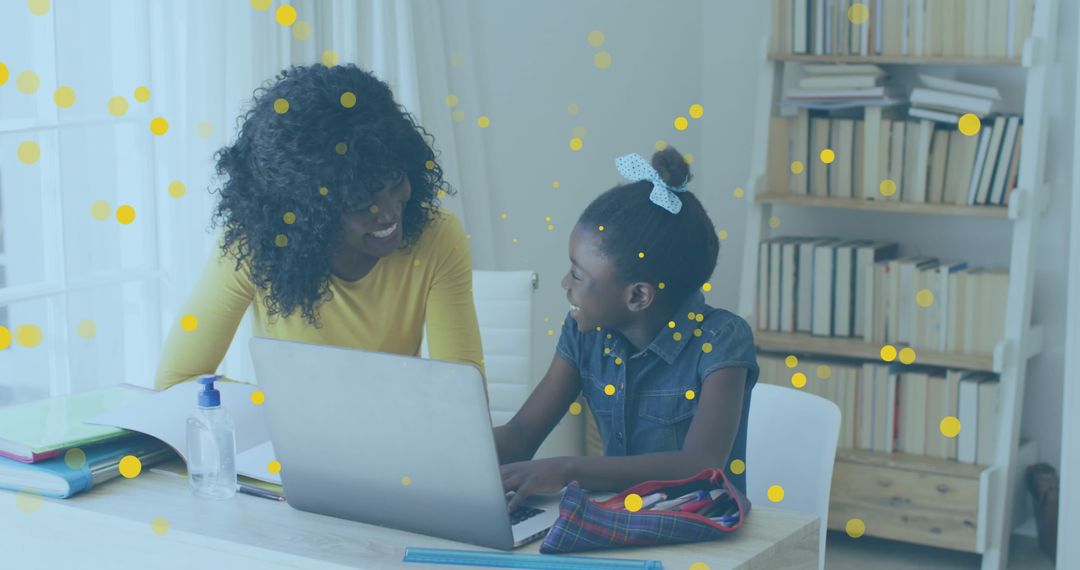 Mother Assists Daughter With Online Learning Assignment at Home