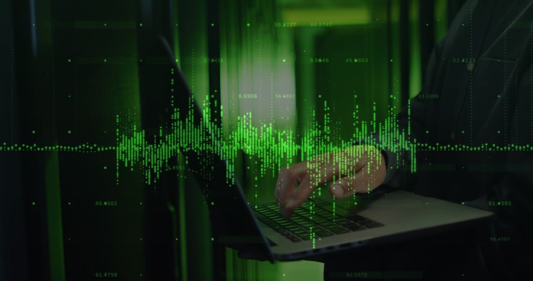 Data Processing in IT Technician Using Laptop near Servers