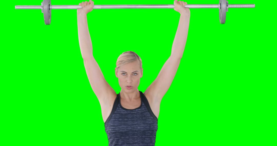 Fitness Enthusiast Lifting Barbell Against Green Screen - Free Images, Stock Photos and Pictures on Pikwizard.com