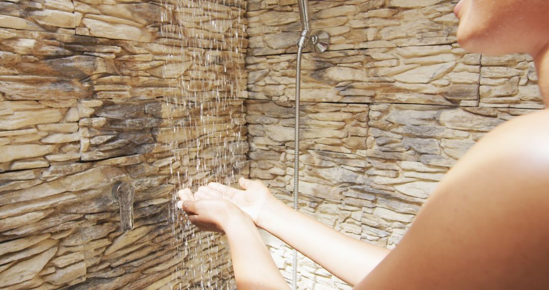 Image of hands of african american woman showering with water - Free Images, Stock Photos and Pictures on Pikwizard.com