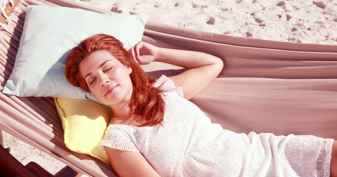 Red-haired Woman Relaxing on Beach Hammock Enjoying Sunny Day - Free Images, Stock Photos and Pictures on Pikwizard.com