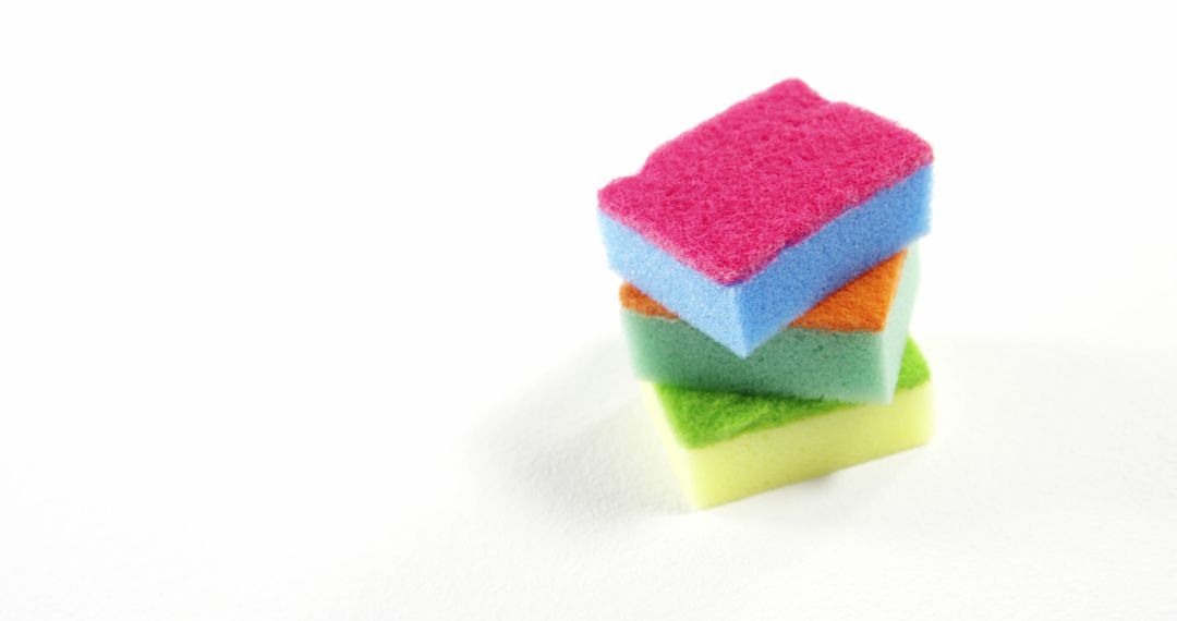 Colorful Stacked Cleaning Sponges on White Background - Free Images, Stock Photos and Pictures on Pikwizard.com