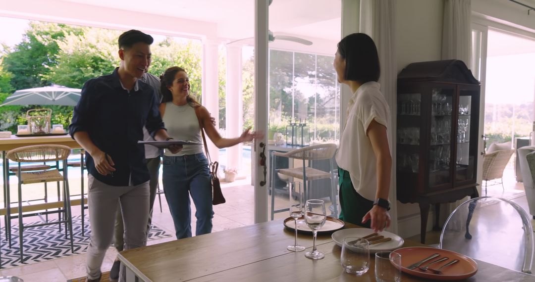 Couple Collaborating with Wedding Planner in Elegant Dining Space