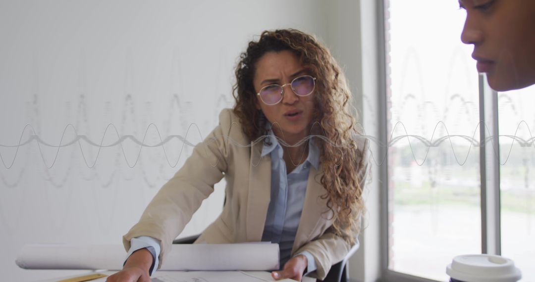 Architect Collaborating on Blueprints in Modern Office