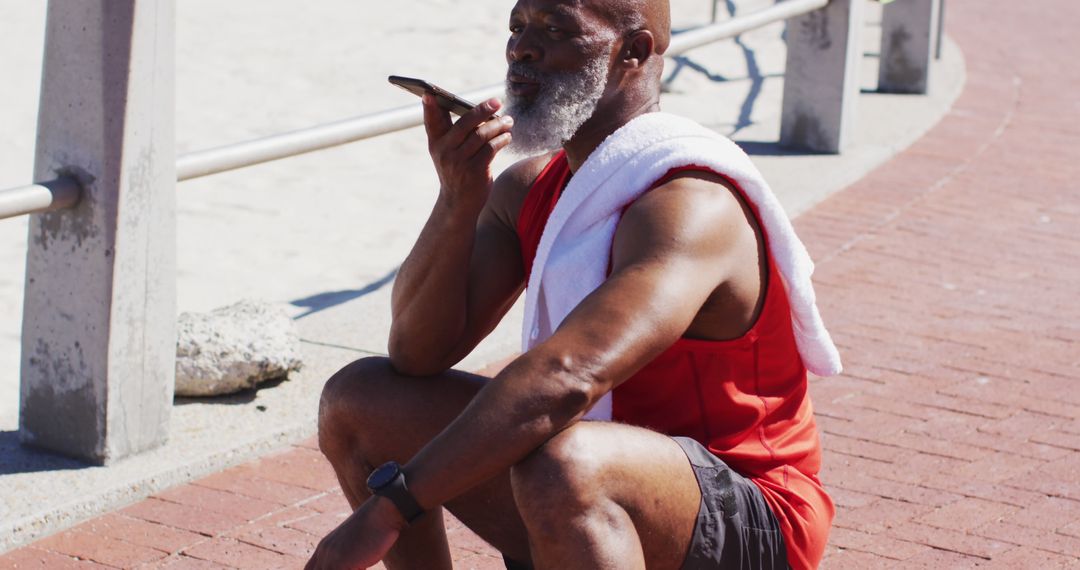 Senior Man Taking Break Using Smartphone at Beach - Free Images, Stock Photos and Pictures on Pikwizard.com