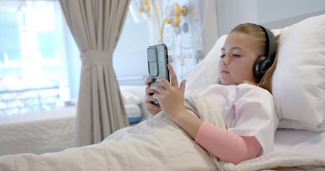 Young Girl in Hospital Bed Using Tablet with Headphones - Free Images, Stock Photos and Pictures on Pikwizard.com